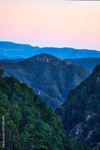 sunset in mountains with sky of colors and blue mountains, sierra madre occidental in mexiquillo durango  photo