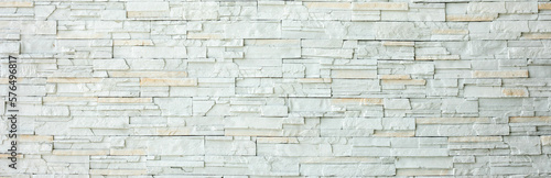White brick wall as a background or texture, horizontal shape with space for design. Web banner. Wide. Panoramic. Website header
