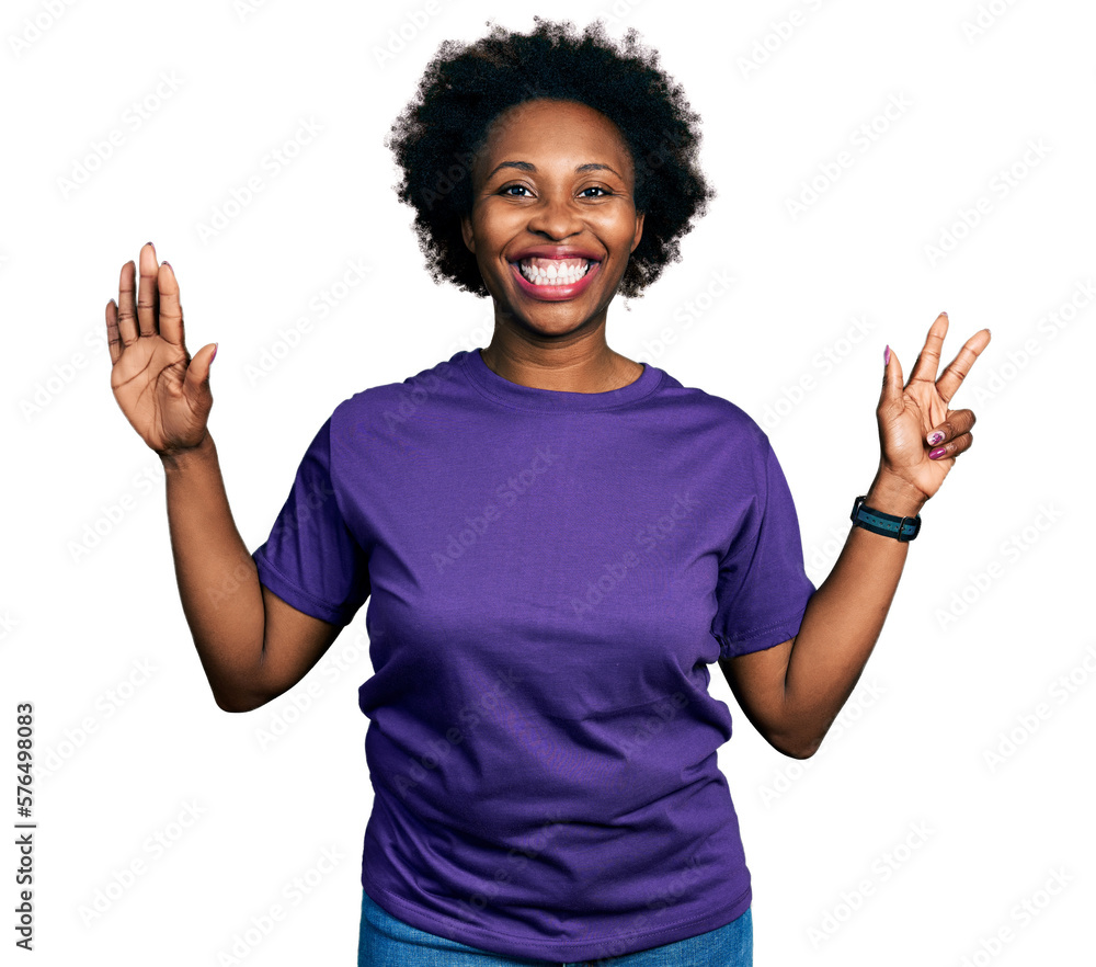 African american woman with afro hair wearing casual purple t shirt showing and pointing up with fingers number eight while smiling confident and happy. African american woman with afro hair wearing casual purple t shirt showing and pointing up with fingers number eight while smiling confident and happy.
