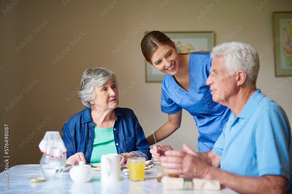 Hows breakfast. Shot of two residents and a nurse at a retirement home. Hows breakfast. Shot of two residents and a nurse at a retirement home.