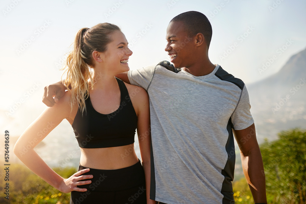 Naklejka premium I can always count on you to keep me motivated. Shot of a fit young couple working out together outdoors.