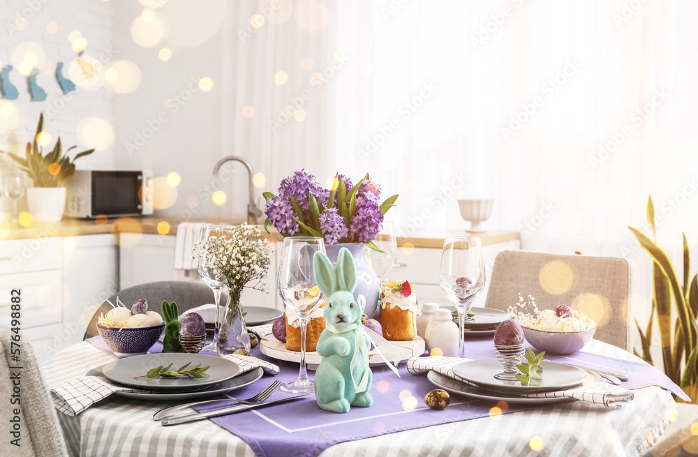 Festive table setting for Easter celebration in kitchen Festive table setting for Easter celebration in kitchen
