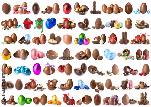 Set of sweet chocolate eggs and bunnies on white background
