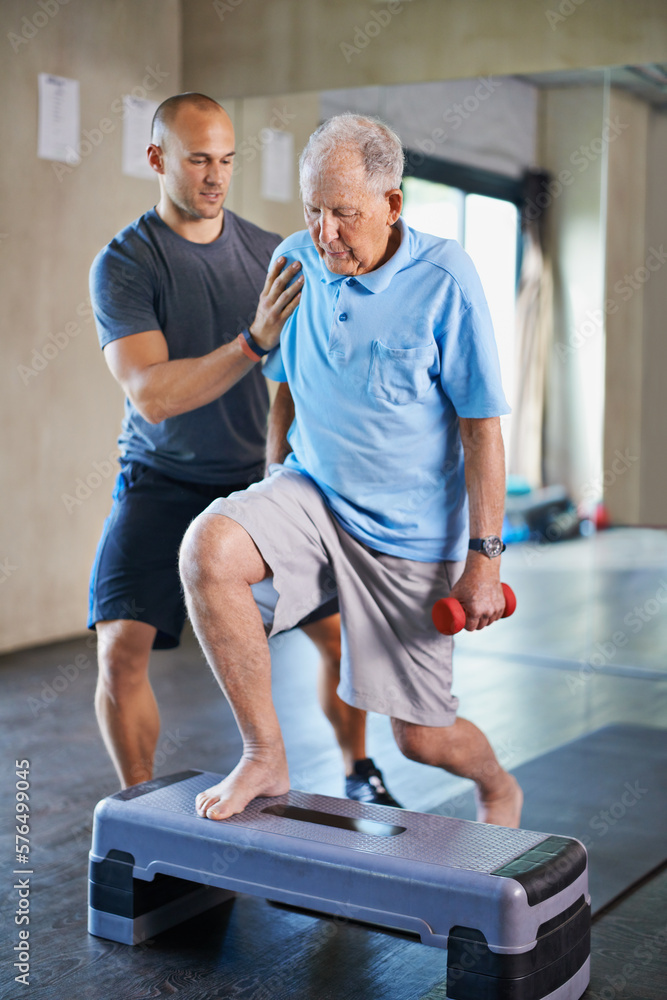 Its not easy, I know. Cropped shot of a handsome personal trainer with a senior man. Its not easy, I know. Cropped shot of a handsome personal trainer with a senior man.