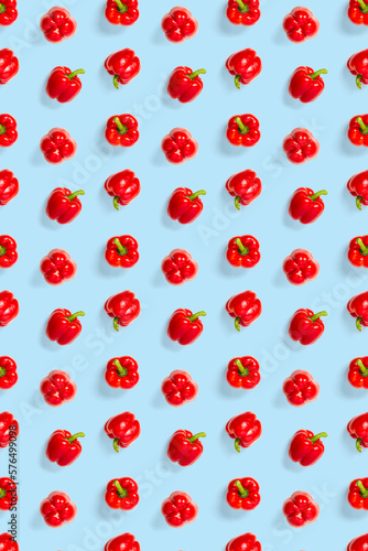 Bulgarian red ripe pepper on blue backdrop. background from paprika, flat lay not seamless pattern