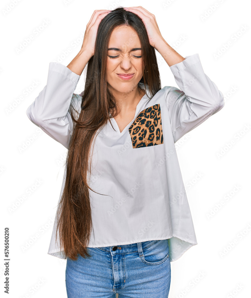 Young hispanic girl wearing casual clothes suffering from headache desperate and stressed because pain and migraine. hands on head. Young hispanic girl wearing casual clothes suffering from headache desperate and stressed because pain and migraine. hands on head.