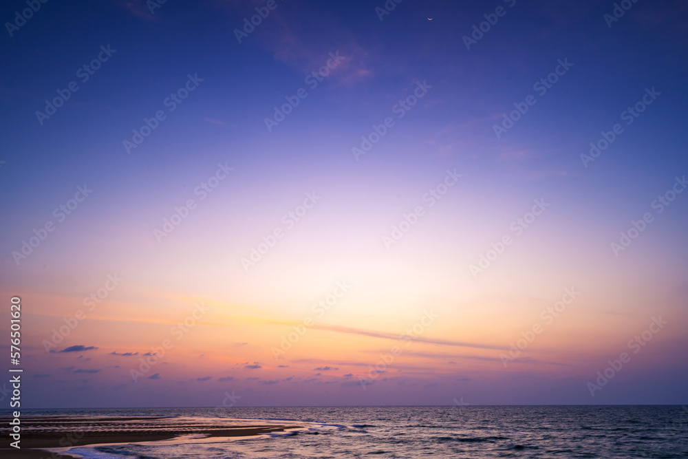 Beautiful Light Sunset or sunrise over sea, Colorful dramatic beach scenery Sky with Amazing clouds and waves in sunset sky nature light cloud background