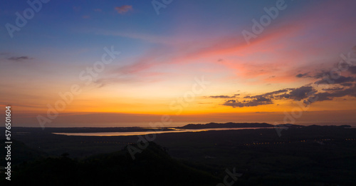 Aerial view beautiful sunset or sunrise light dramatic sky over mountain landscape © panya99