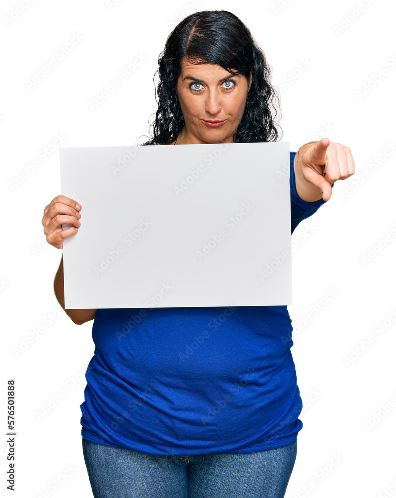 Plus size brunette woman holding blank empty banner celebrating victory with happy smile and winner expression with raised hands Plus size brunette woman holding blank empty banner celebrating victory with happy smile and winner expression with raised hands