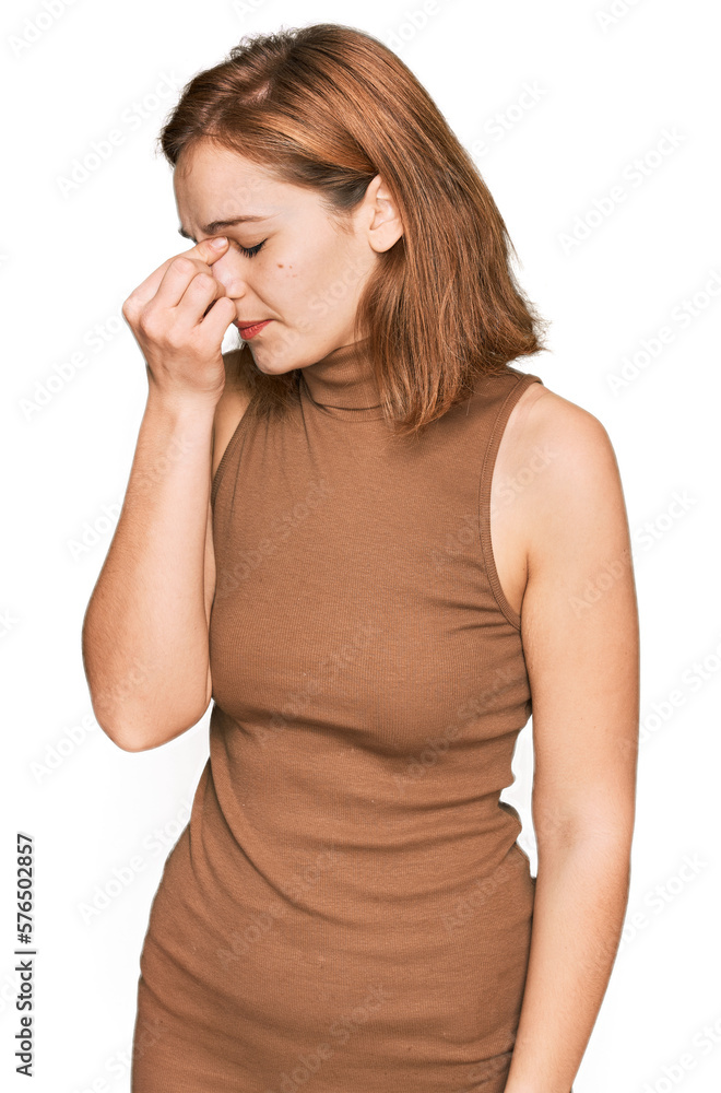 Young caucasian woman wearing casual clothes tired rubbing nose and eyes feeling fatigue and headache. stress and frustration concept. Young caucasian woman wearing casual clothes tired rubbing nose and eyes feeling fatigue and headache. stress and frustration concept.