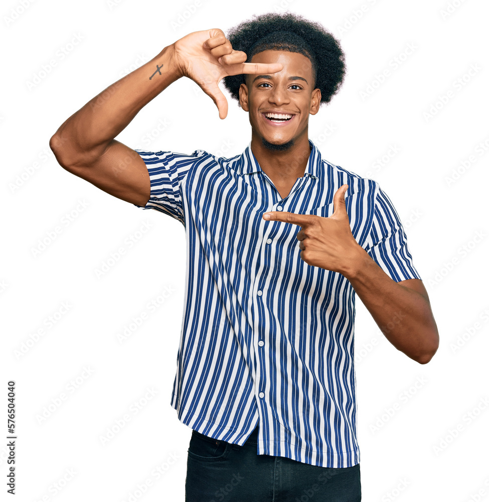 African american man with afro hair wearing casual clothes smiling making frame with hands and fingers with happy face. creativity and photography concept. African american man with afro hair wearing casual clothes smiling making frame with hands and fingers with happy face. creativity and photography concept.