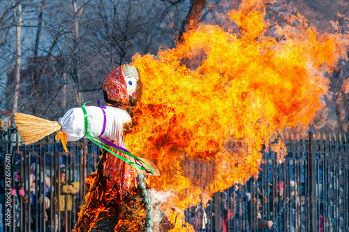 Wallpaper Mural Large ritual fire with a beautiful texture. Burning doll from branches and straw. Maslenitsa is a traditional Slavic holiday of the end of winter and the beginning of spring. Bright flame in the wind. Torontodigital.ca
