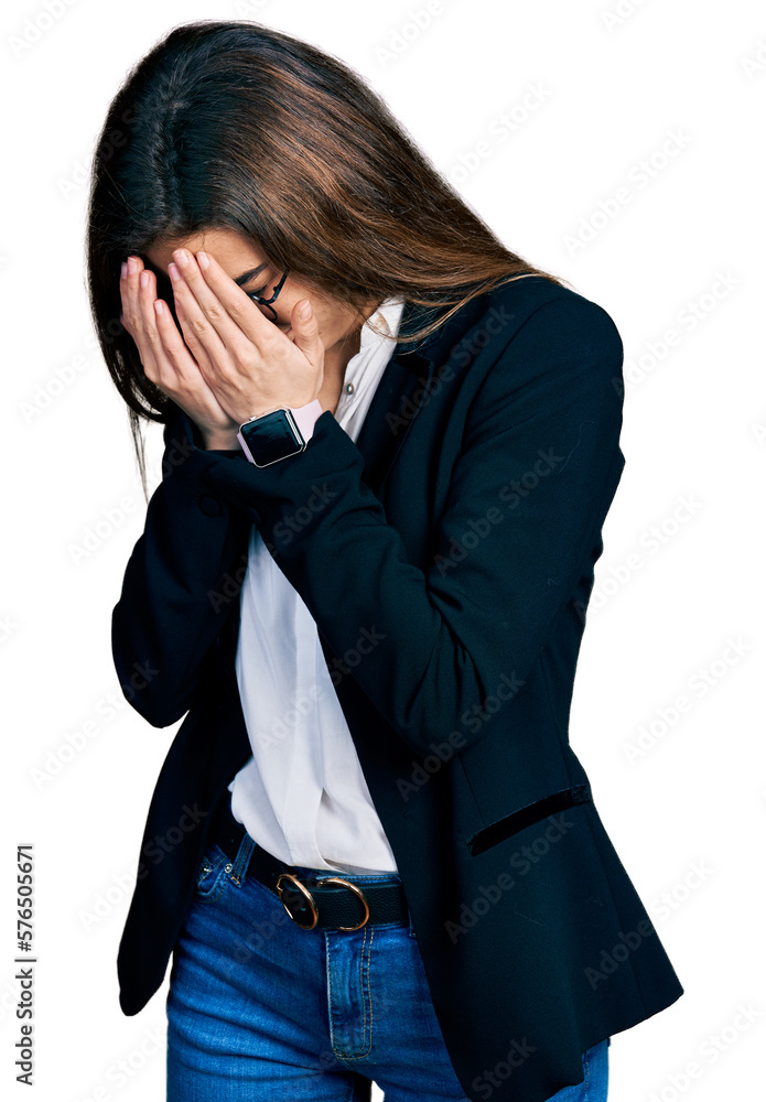 Young caucasian girl wearing business style and glasses with sad expression covering face with hands while crying. depression concept.