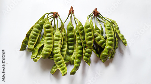 Raw of petai or pete (Parkia speciosa). Usually eaten raw and cooked, popular with name stink bean or bitter bean. Pete plants grow a lot in Indonesia. Indonesia use petai for fresh vegetable, dishes. photo