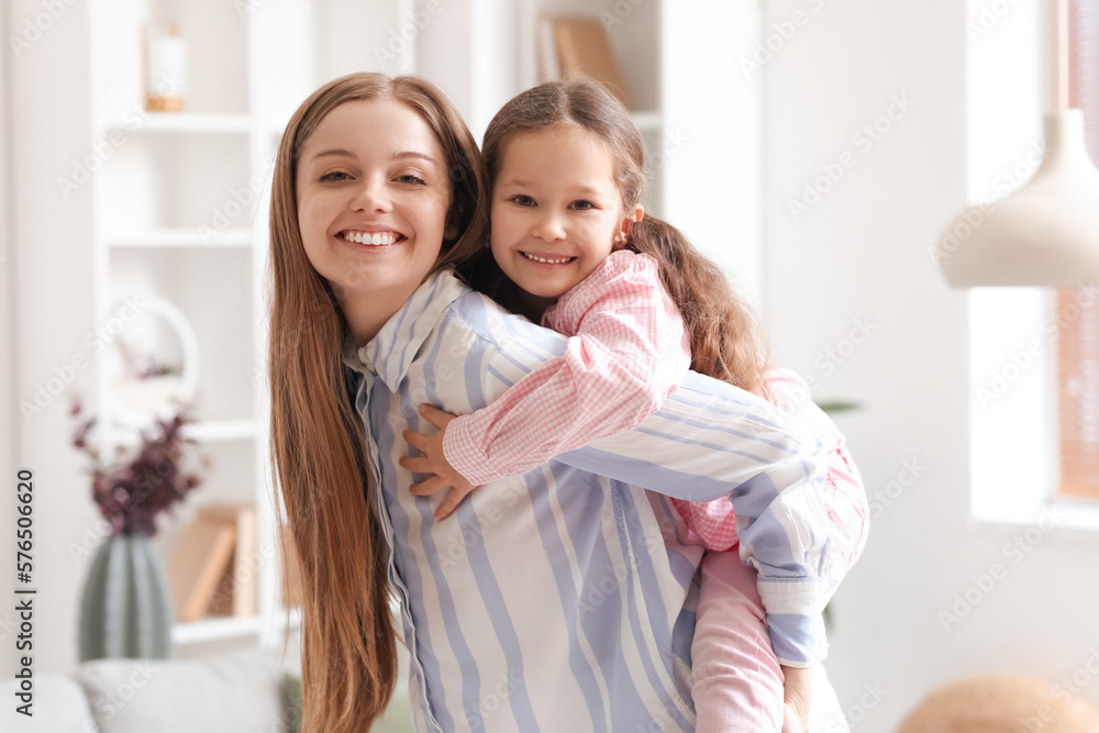 Cute little girl with her mom at home on Mother's Day Cute little girl with her mom at home on Mother's Day