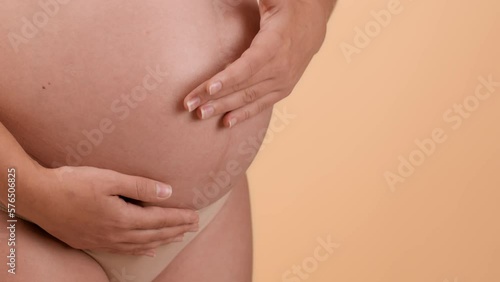 Wallpaper Mural Pregnancy body care. Close up of pregnant woman big belly, unrecognizable expectant lady rubbing pampering cream on skin Torontodigital.ca