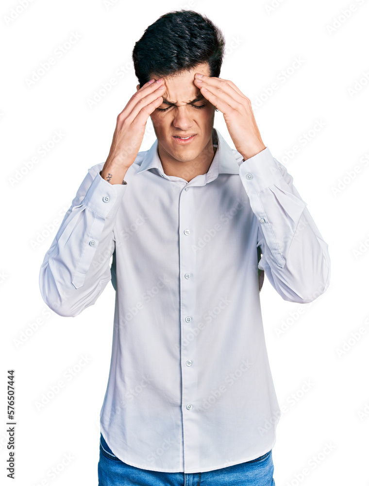Young hispanic business man wearing business clothes with hand on head for pain in head because stress. suffering migraine. Young hispanic business man wearing business clothes with hand on head for pain in head because stress. suffering migraine.