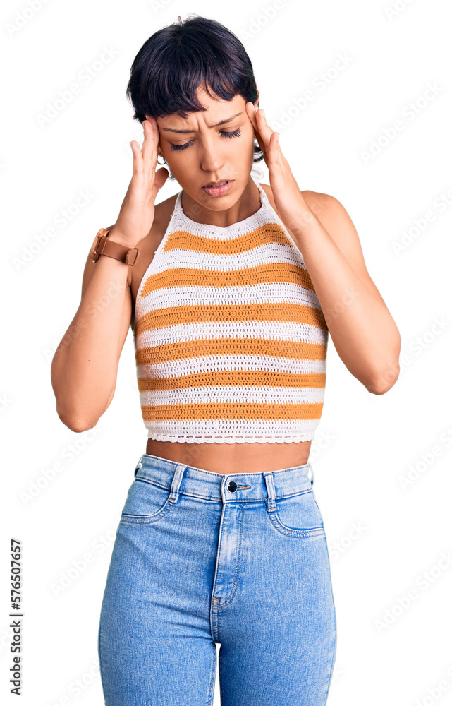 Young brunette woman with short hair wearing casual clothes with hand on head, headache because stress. suffering migraine. Young brunette woman with short hair wearing casual clothes with hand on head, headache because stress. suffering migraine.