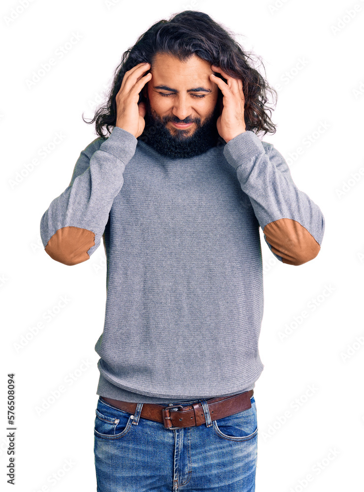 Young arab man wearing casual clothes with hand on head for pain in head because stress. suffering migraine. Young arab man wearing casual clothes with hand on head for pain in head because stress. suffering migraine.