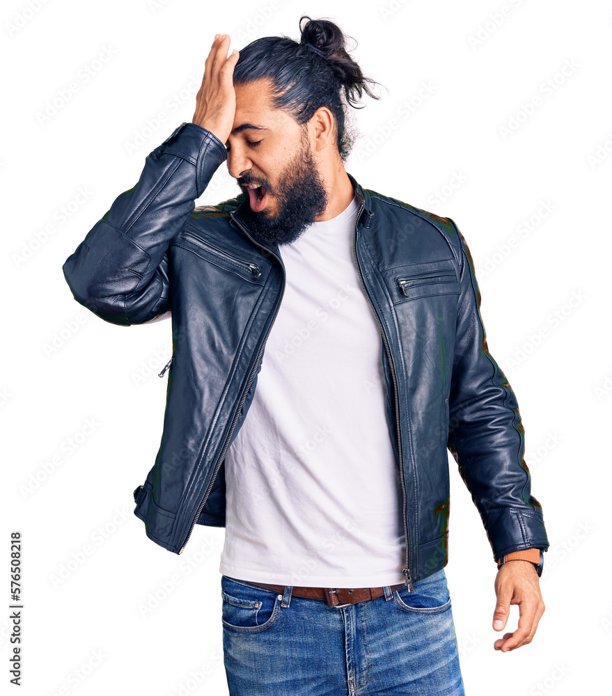 Young arab man wearing casual leather jacket surprised with hand on head for mistake, remember error. forgot, bad memory concept. Young arab man wearing casual leather jacket surprised with hand on head for mistake, remember error. forgot, bad memory concept.