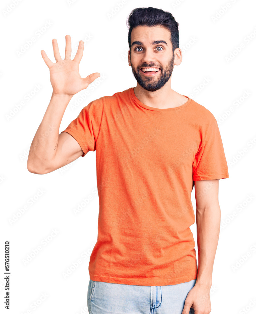 Young handsome man with beard wearing casual t-shirt showing and pointing up with fingers number five while smiling confident and happy. Young handsome man with beard wearing casual t-shirt showing and pointing up with fingers number five while smiling confident and happy.