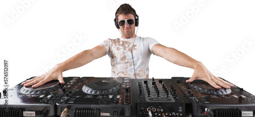 Canvastavla Portrait of confident young DJ with headphones on head mixing music on mixer