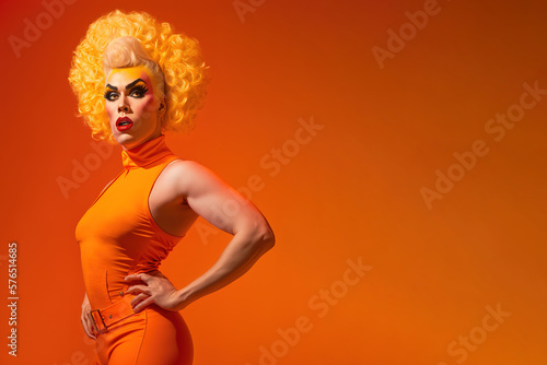 Drag queen posing over orange background studio shot with copy space for advertisement or text. Generative AI photo