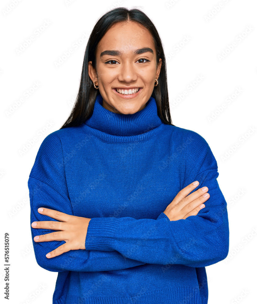 Young asian woman wearing casual winter sweater happy face smiling with crossed arms looking at the camera. positive person. Young asian woman wearing casual winter sweater happy face smiling with crossed arms looking at the camera. positive person.