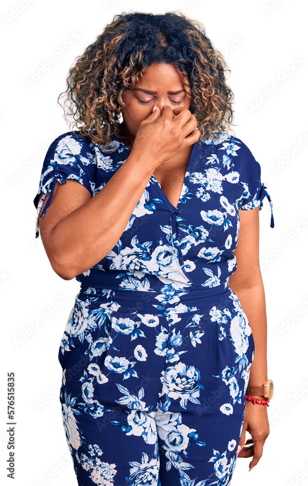 Young african american plus size woman wearing casual clothes tired rubbing nose and eyes feeling fatigue and headache. stress and frustration concept. Young african american plus size woman wearing casual clothes tired rubbing nose and eyes feeling fatigue and headache. stress and frustration concept.