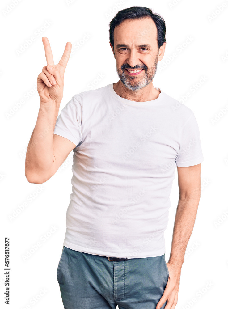 Middle age handsome man wearing casual t-shirt smiling looking to the camera showing fingers doing victory sign. number two. Middle age handsome man wearing casual t-shirt smiling looking to the camera showing fingers doing victory sign. number two.