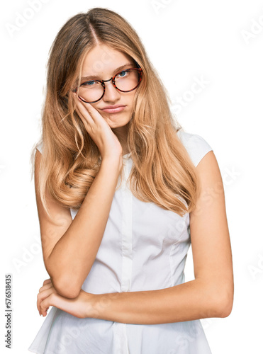 Beautiful young caucasian girl wearing casual clothes and glasses thinking looking tired and bored with depression problems with crossed arms.