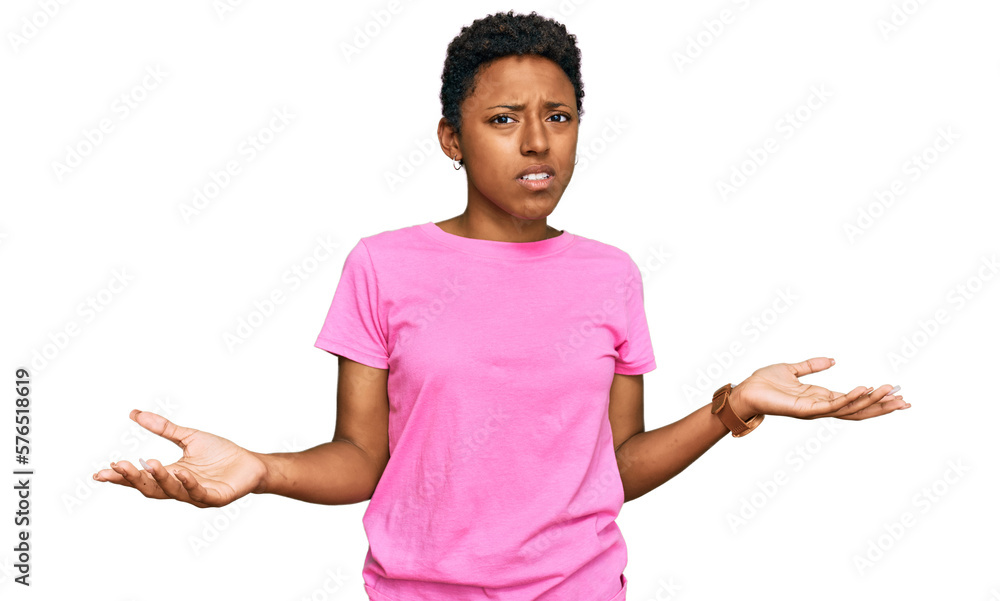 Young african american woman wearing casual clothes clueless and confused with open arms, no idea concept. Young african american woman wearing casual clothes clueless and confused with open arms, no idea concept.