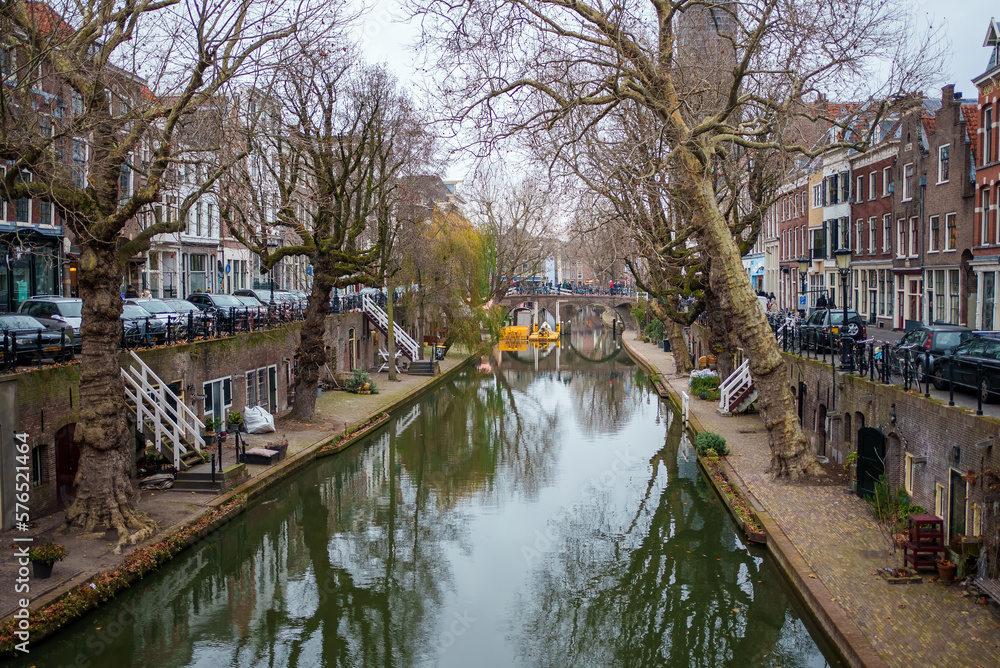 Ancient city center of Utrecht, Netherland - canal view with cafes, restaurants and shops in winter or autumn time