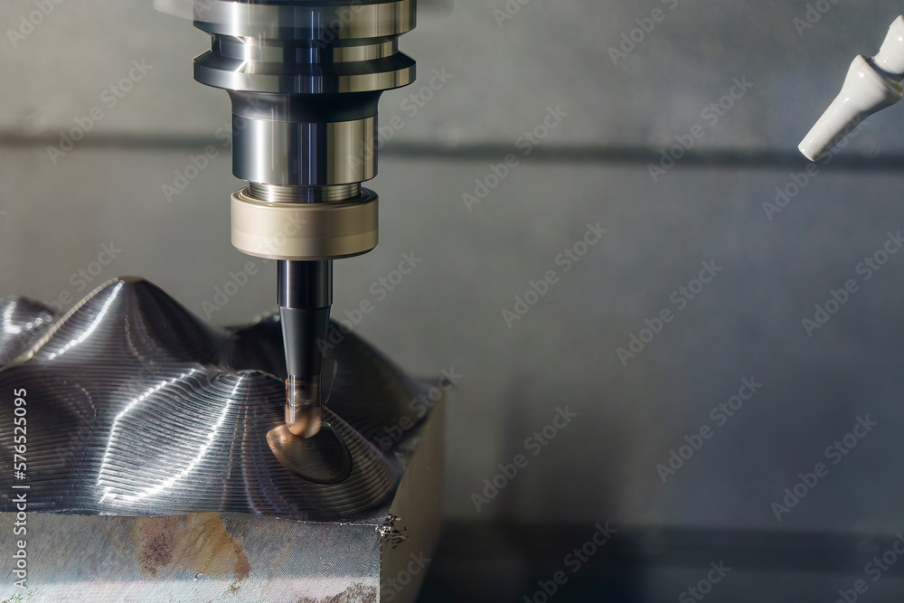 The CNC milling machine rough cutting the mold parts by indexable ball tools. The CNC milling machine rough cutting the mold parts by indexable ball tools.