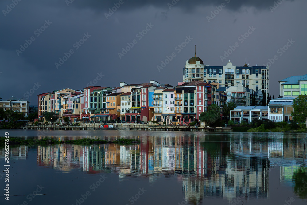 Colorful apartment buildings with storm brewing in background