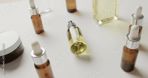 Wallpaper Mural Close up of cream tub and glass bottles with copy space on white background Torontodigital.ca