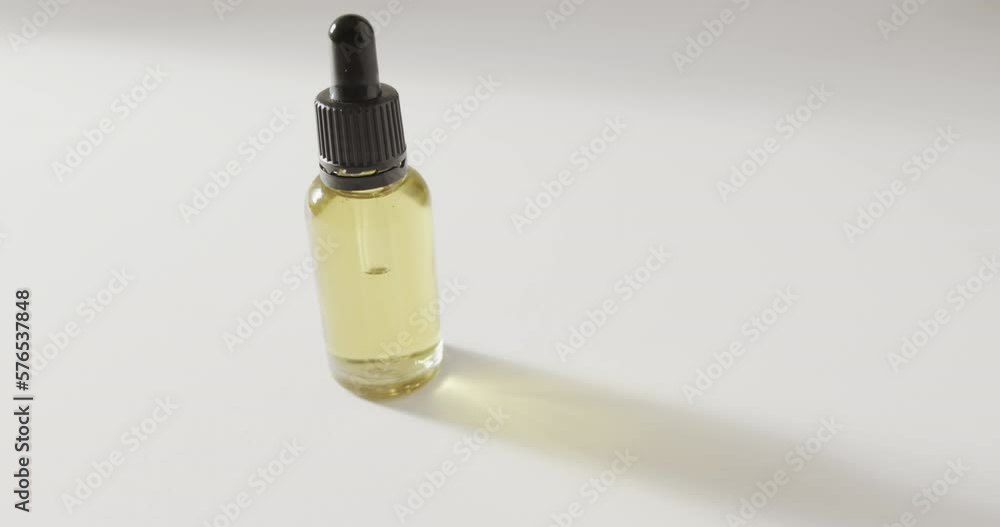 Close up of glass bottle with pump and copy space on white background Close up of glass bottle with pump and copy space on white background