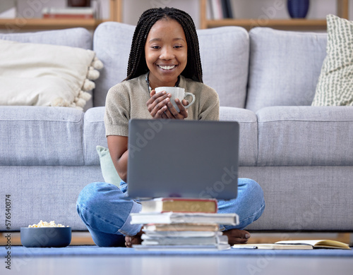 Φωτογραφία Coffee, student and laptop for girl in living room, happy and relax while streaming in her home