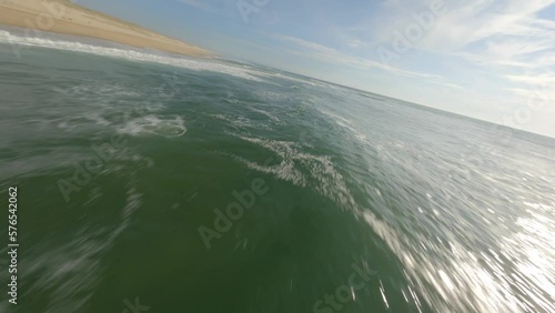 Wallpaper Mural Drone flying low over ocean waters surface along Soustons beach, France. Aerial fpv Torontodigital.ca