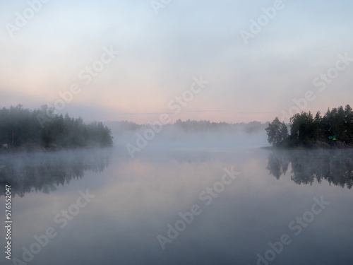 landscape with morning mist over lake