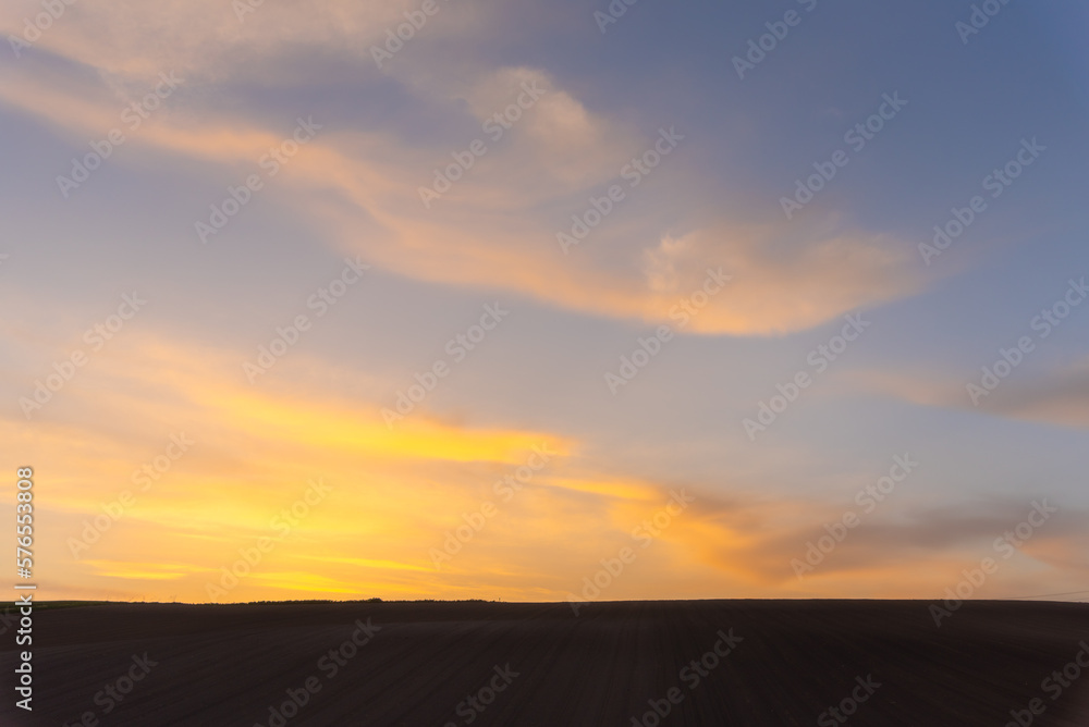 Farmland, a hill with blue sky background in dusk. Silhouette view nature landscape.