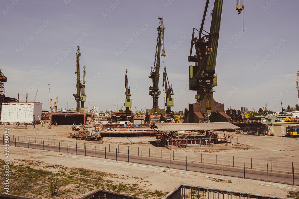 Industrial building at the Gdansk Shipyard, former Lenin Shipyard, prefabrication workshop and heavy cranes large Polish shipyard. Cranes at historical shipyard in Gdansk headquarters of Solidarity