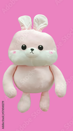 soft pink rabbit toy isolated at pink background.