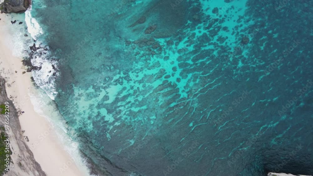 Nusa Penida kelingking beach bali drone aerial top flying above view famous place in Asia indonesia colorful reef aqua water sea ocean underwater cliffs deep blue waves beautiful paradise environment Nusa Penida kelingking beach bali drone aerial top flying above view famous place in Asia indonesia colorful reef aqua water sea ocean underwater cliffs deep blue waves beautiful paradise environment