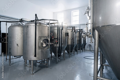 interior of a modern brewery with beer fermentation tanks