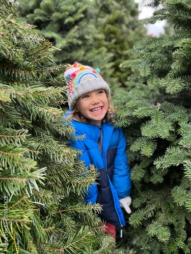 Joyful girl at Christmas tree farm