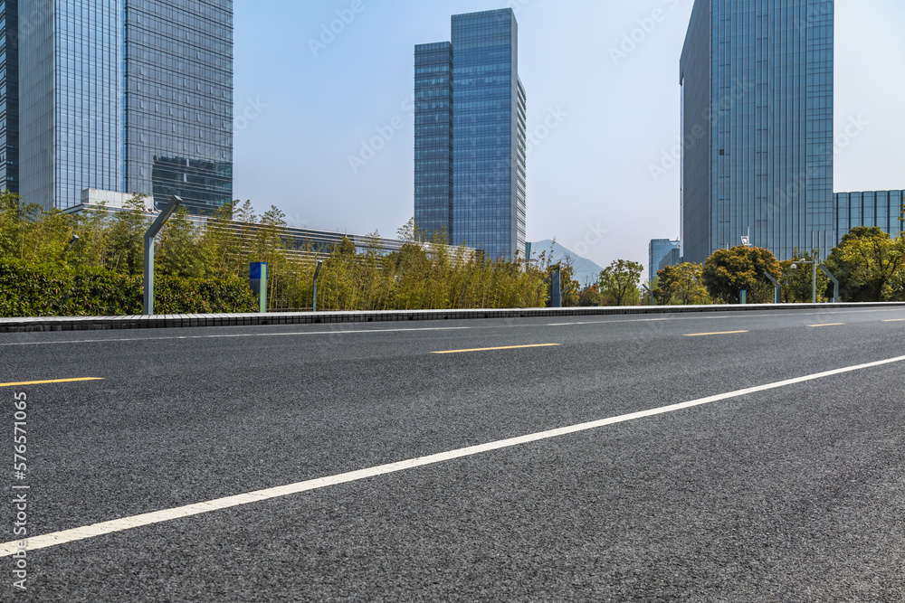 empty road with modern buildings on background, shanghai, china..