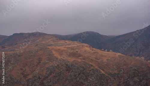 Amazingly beautiful autumn landscapes of a mountainous area located in northern China. Rainy landscape with clouds on top of mountains. Beautiful non-tourist routes. Exploring new places.