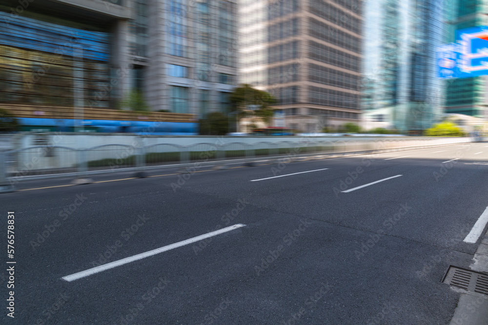 Empty urban road and modern skyline.