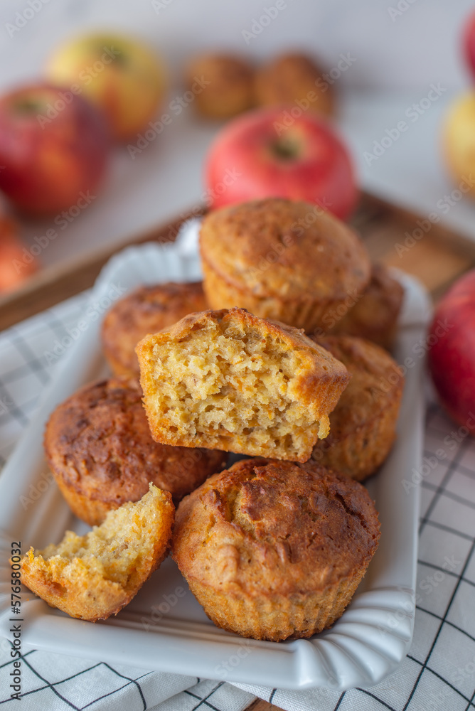 home made apple carrot muffins on a table